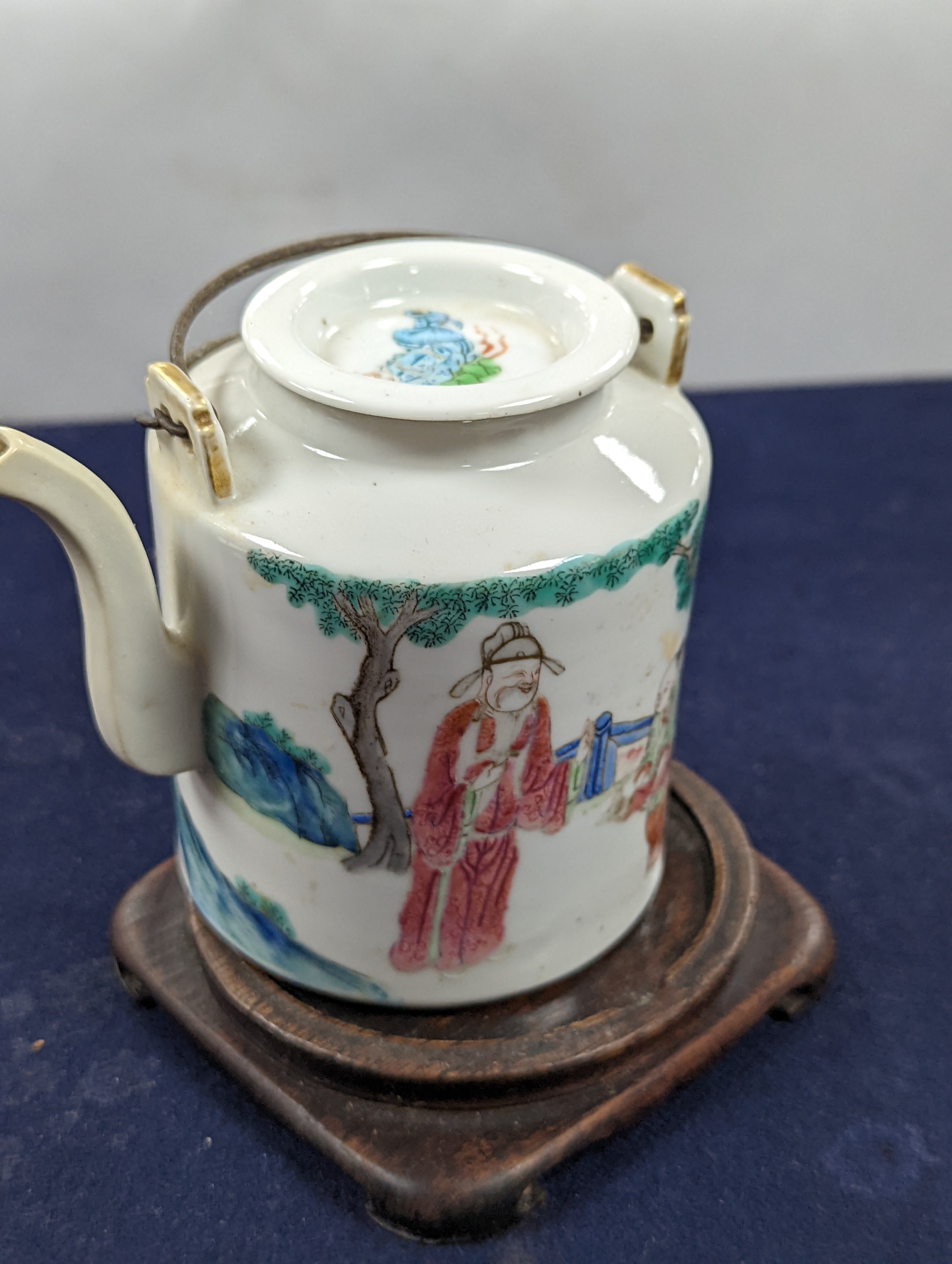 A Chinese famille rose cylindrical teapot and cover, 19th century 11cm, wood stand